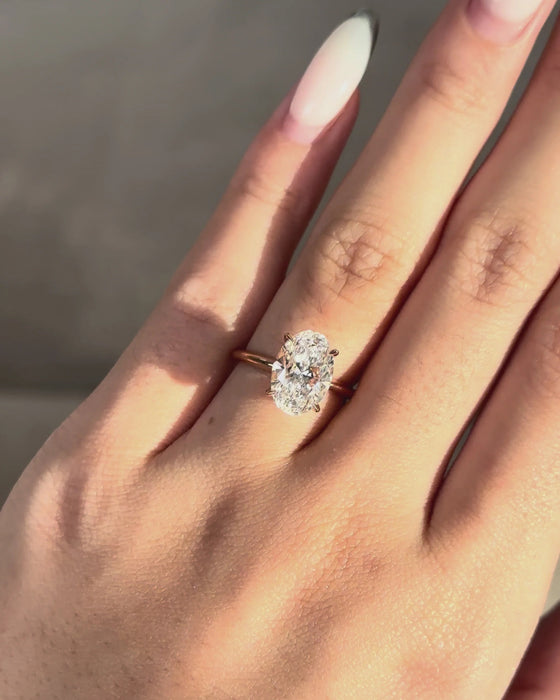 Solitaire Oval Cut Diamond Ring with Knife Edge