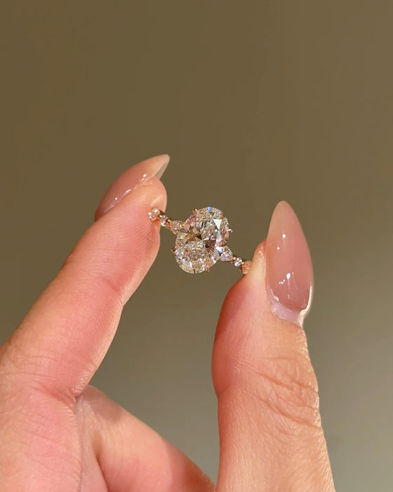 Oval Cut Diamond Ring with Round and Marquise Accent