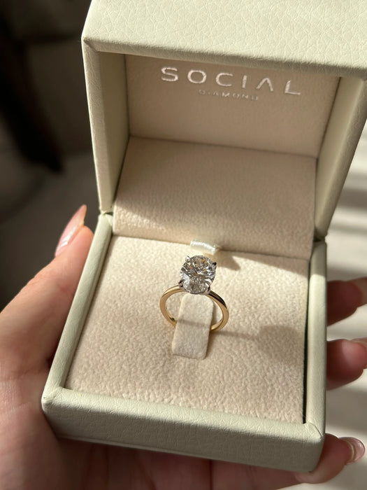 Two Tone Oval Cut Diamond Ring with Hidden Halo