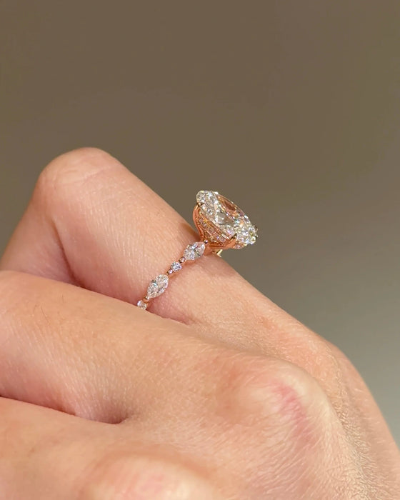Oval Cut Diamond Ring with Round and Marquise Accent