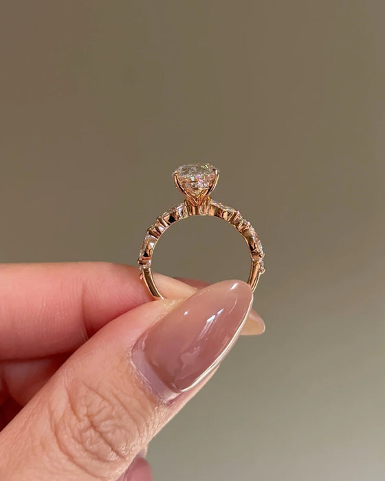 Oval Cut Diamond Ring with Round and Marquise Accent