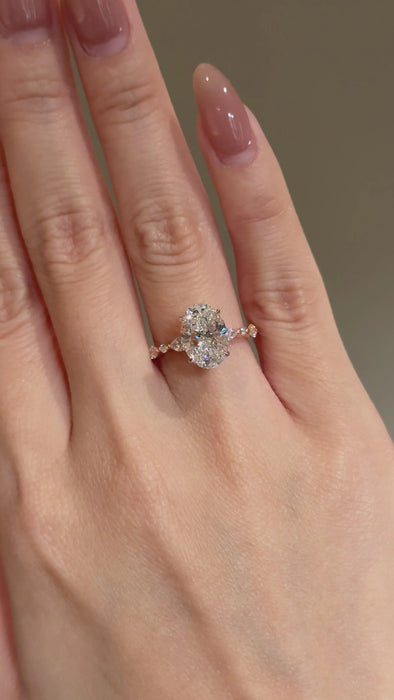 Oval Cut Diamond Ring with Round and Marquise Accent