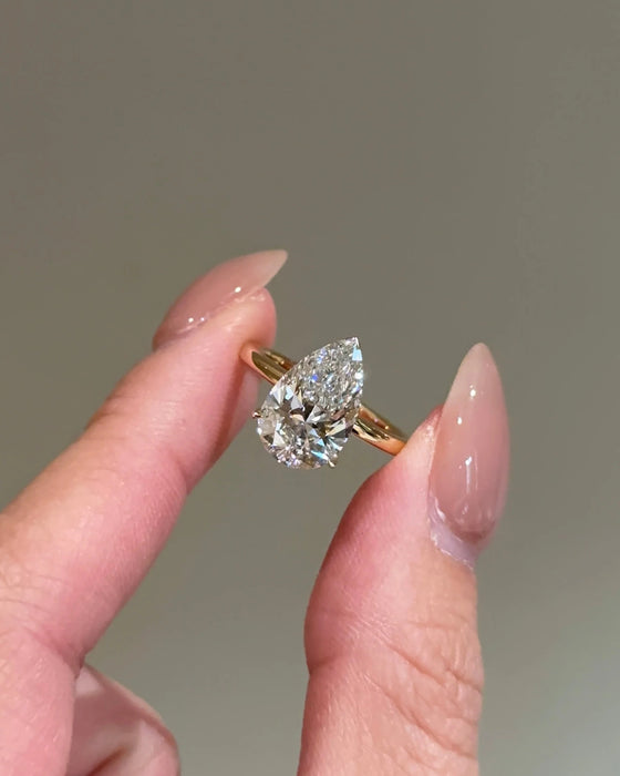 Solitaire Pear Cut Diamond Ring with Plain Band