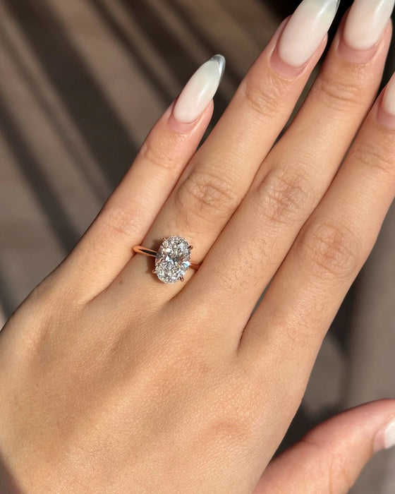 Solitaire Oval Cut Diamond Ring with Knife Edge