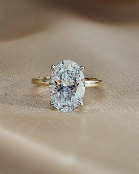 Two Tone Oval Cut Diamond Ring with Hidden Halo