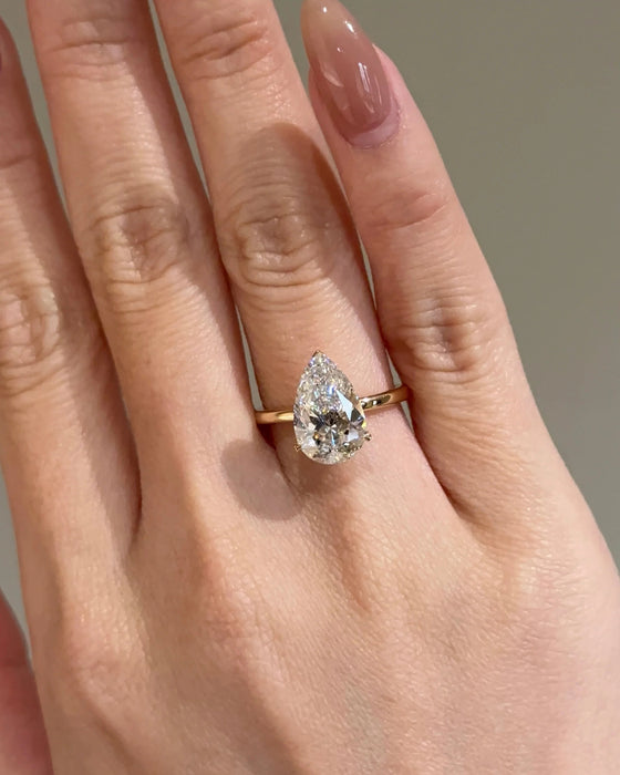 Solitaire Pear Cut Diamond Ring with Plain Band