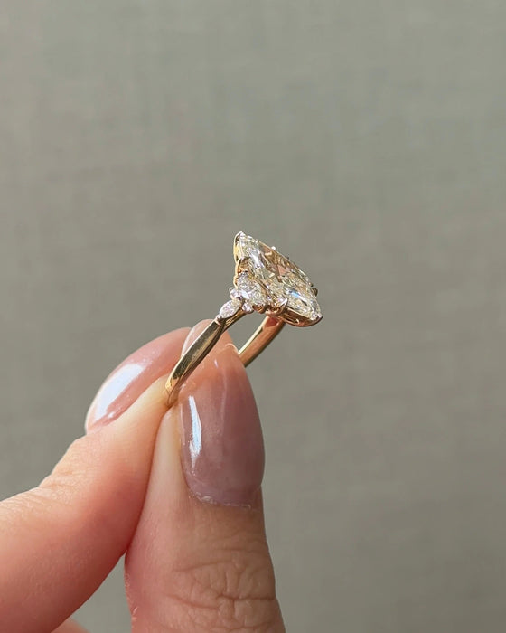 Marquise Cut Diamond Ring with Side Stones