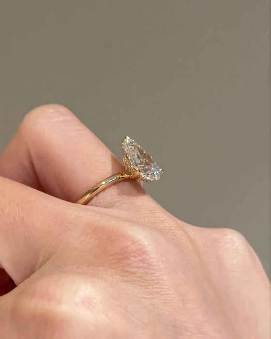 Solitaire Pear Cut Diamond Ring with Plain Band