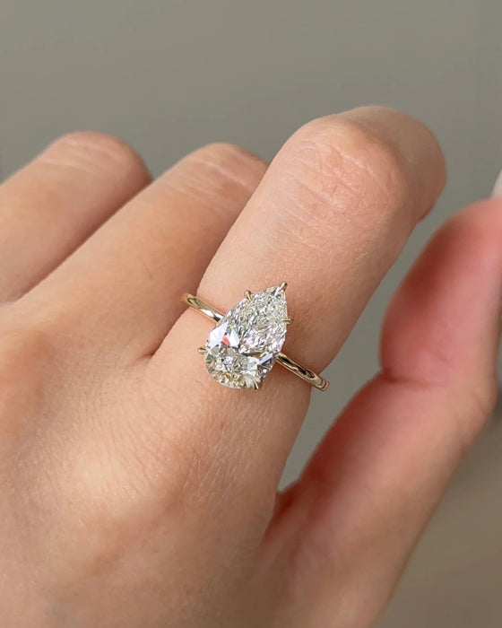 Solitaire Pear Cut Diamond Ring with Hidden Halo