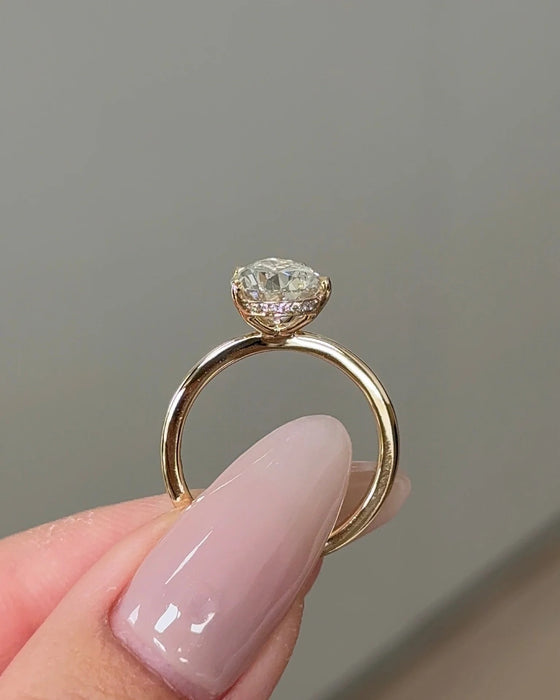 Solitaire Pear Cut Diamond Ring with Hidden Halo