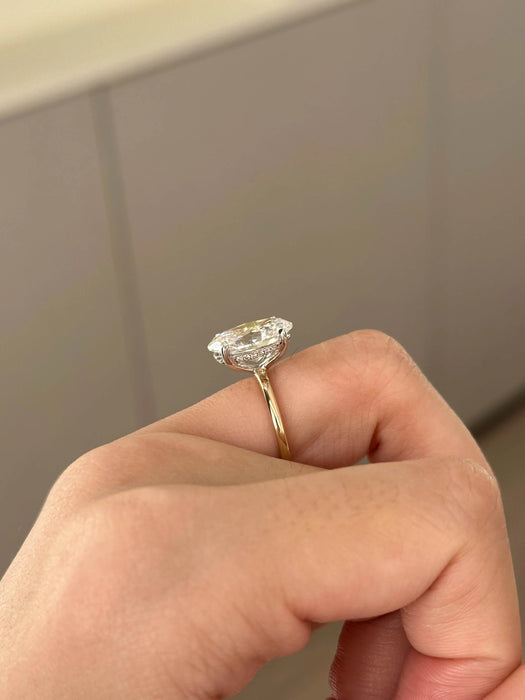 Two Tone Oval Cut Diamond Ring with Hidden Halo