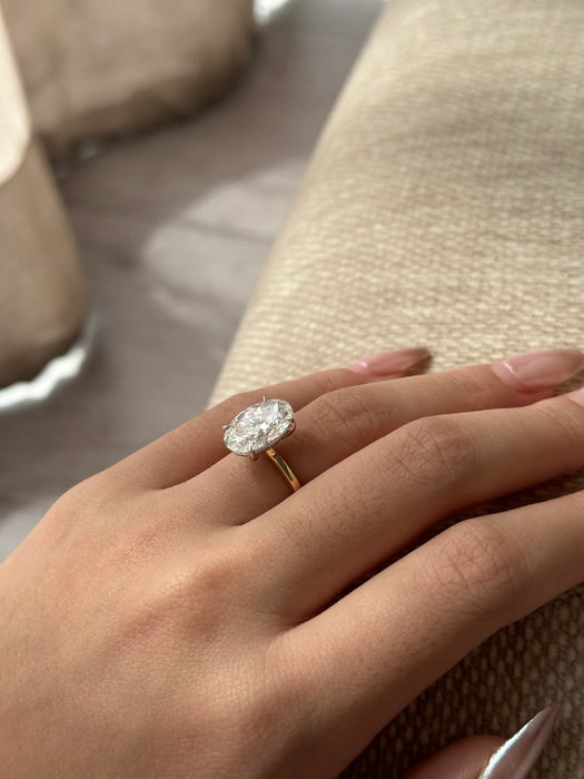 Two Tone Oval Cut Diamond Ring with Hidden Halo