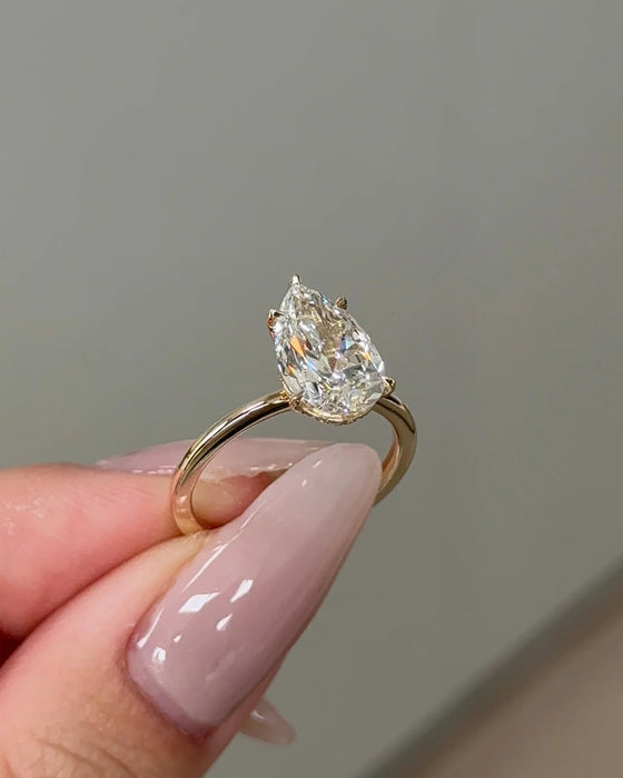 Solitaire Pear Cut Diamond Ring with Hidden Halo